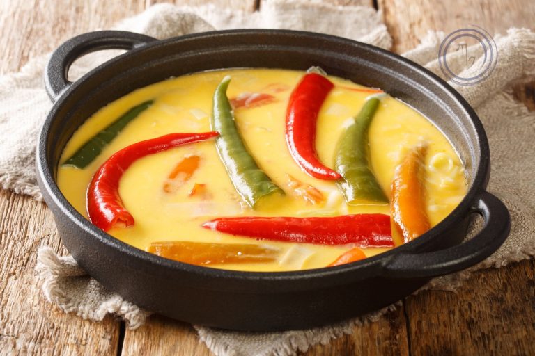 Traditional Bhutanese ema datshi with red rice in Paro Bhutan